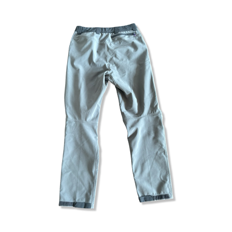 Men's grey Patagonia hiking pants with a zippered back pocket, back view on a white background.
