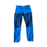 Men's Norröna Bitihorn hiking pants in a two-tone blue design, front view against a white background.
