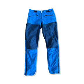 Men's Norröna Bitihorn hiking pants in a two-tone blue design, front view against a white background.