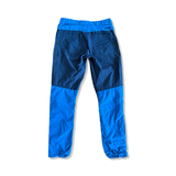 Men's Norröna Bitihorn hiking pants in two shades of blue, back view on a white background.