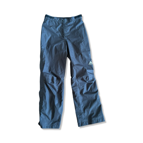 Men's black Vaude Gore-Tex rain pants in size M, front view against a white background.