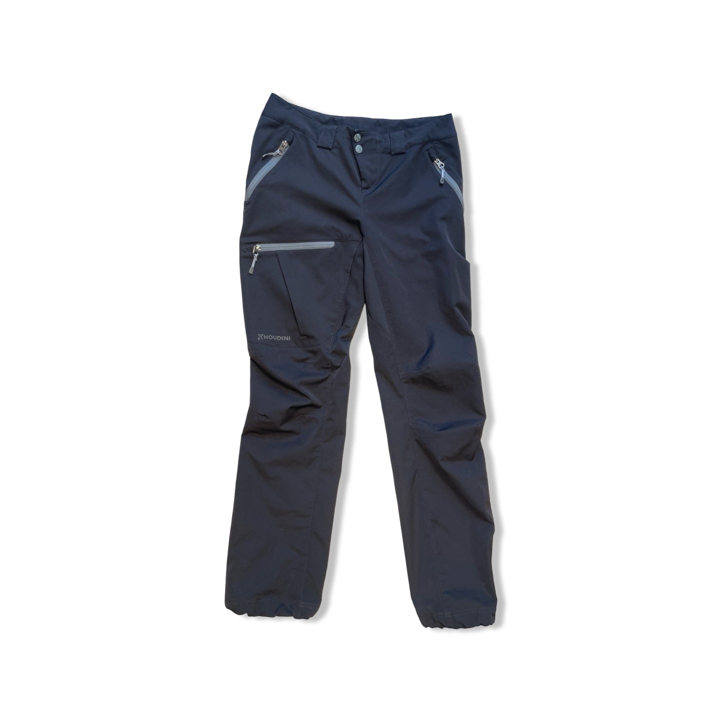 Houdini Motion Pants softshellbyxor för dam i svart, fotograferade framifrån mot en vit bakgrund.