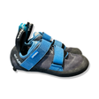 Black and blue Scarpa women's climbing shoes with Velcro straps, photographed against a white background.