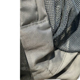 Close-up of the grey Deuter Futura 22L AC backpack fabric and mesh pocket showing a small stain.