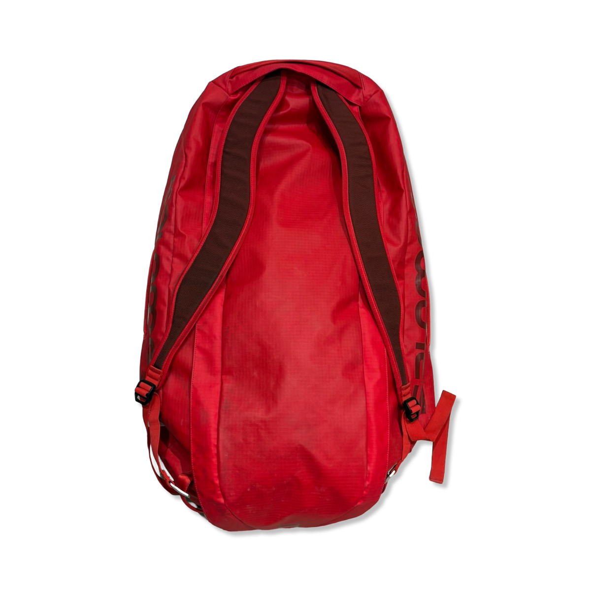 Red Salomon Outlife 70 L bag, back view against a white background.