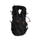 Back view of a black Sandqvist Hike Mountain hiking backpack with brown details against a white background.