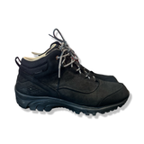 Black Haglöfs men's winter boots with patterned laces, side view against a white background.