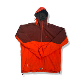 Red and dark pink Haglöfs men's functional jacket with a hood, photographed from the front against a white background.