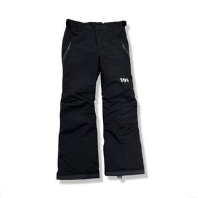 Black Helly Hansen kids' ski pants with zippered pockets, front view against a white background.