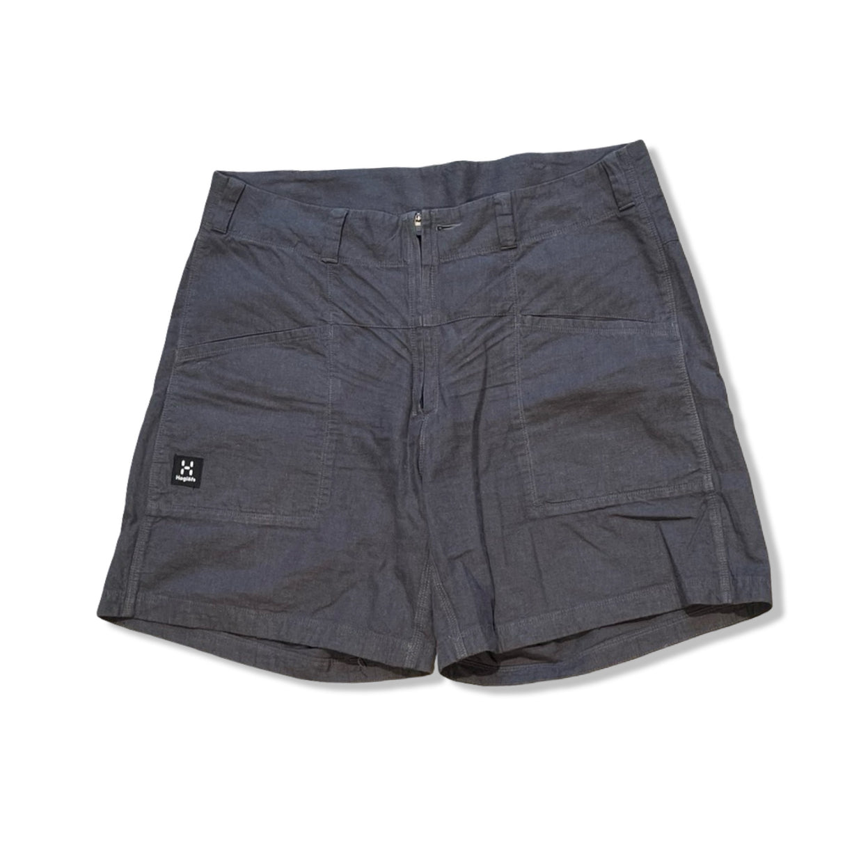 Dark grey Haglöfs Mid Hemp women's shorts with large front pockets, photographed against a white background.