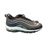 Women's Nike Air Max 97 sneakers in black and silver glitter, side view against a white background.