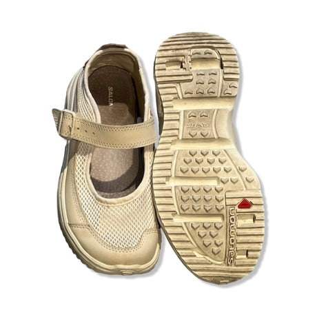 Salomon beige mesh Mary Jane sneakers with a buckle strap, featuring top and outsole views.