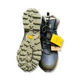 Underside and front view of a blue Alfa men's hiking boot with a patterned Vibram sole, shown against a white background.
