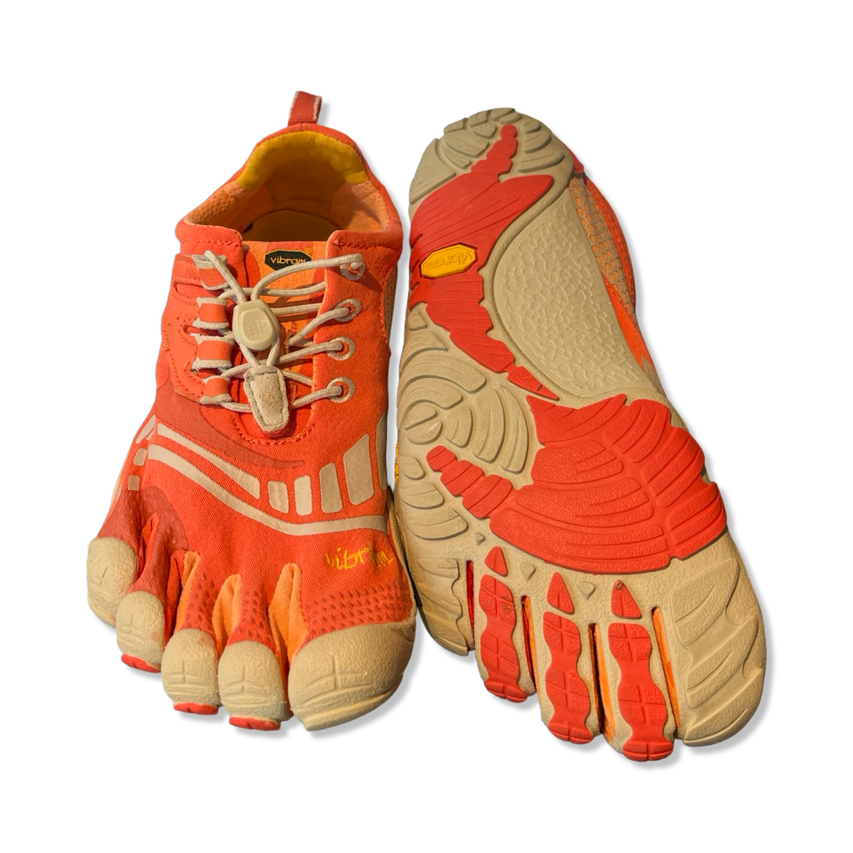 Women's coral Vibram FiveFingers sandals, shown from the top and outsole against a white background.