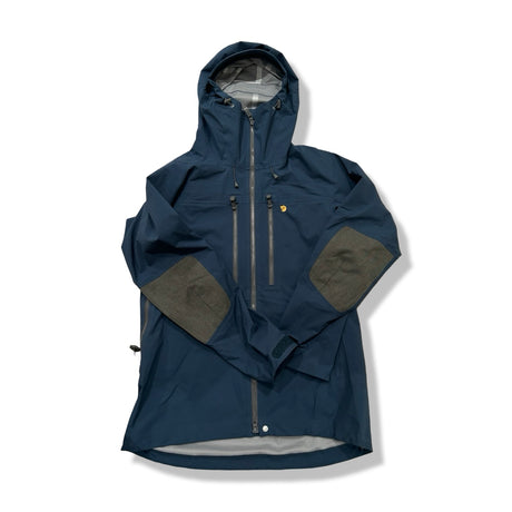 Blue Fjällräven Bergtagen women's shell jacket, front view against a white background.