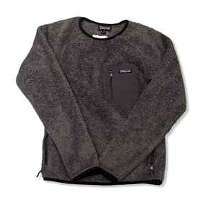 Grey Patagonia women's fleece hoodie with zipper and chest pocket, front view against a white background.