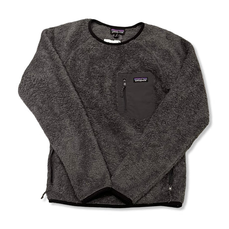 Grey Patagonia women's fleece hoodie with zipper and chest pocket, front view against a white background.