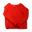Pink knit women's Peak Performance sweatshirt, front view against a white background.