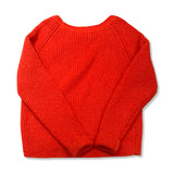 Back view of a pink Peak Performance women's sweatshirt against a white background.