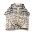 White and blue Dale of Norway women's lusekofta cardigan with pattern and buttons, front view against a white background.