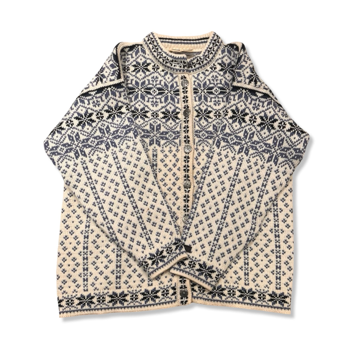 White and blue Dale of Norway women's lusekofta cardigan with pattern and buttons, front view against a white background.