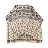 Back view of a white and blue Dale of Norway women's traditional sweater against a white background.