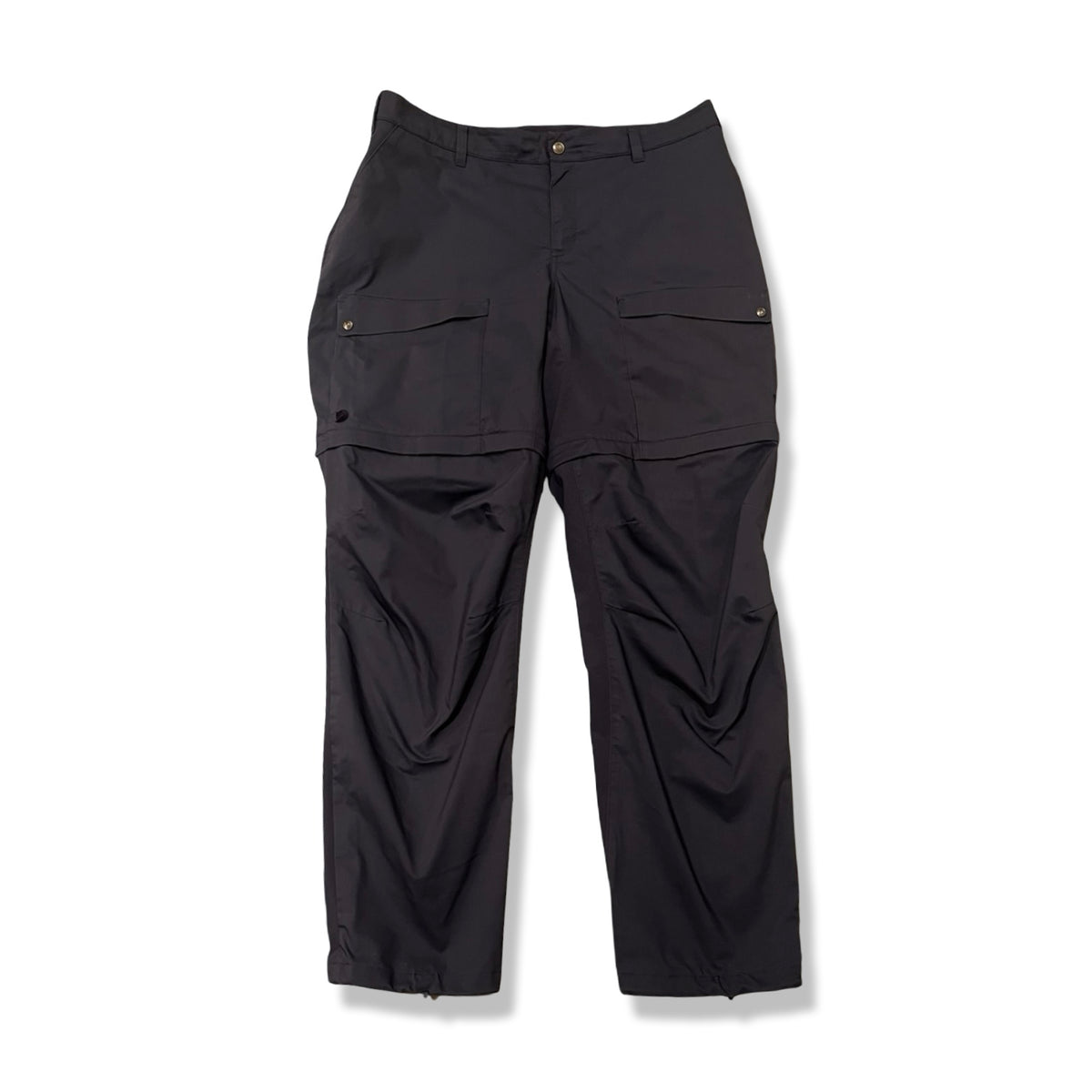 Dark blue Fjällräven Abisko Hybrid Trail Trousers Zip-off women's outdoor pants, front view against a white background.