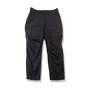 Dark blue Fjällräven Abisko Hybrid Trail Trousers Zip-off women's outdoor pants, front view against a white background.