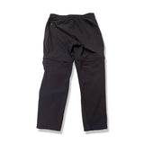Back view of a pair of dark blue Fjällräven Abisko Hybrid Trail Trousers for women against a white background.