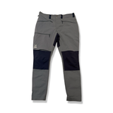 Grey and dark Haglöfs women's hiking pants with reinforced knees, front view against a white background.