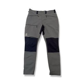 Grey and dark Haglöfs women's hiking pants with reinforced knees, front view against a white background.