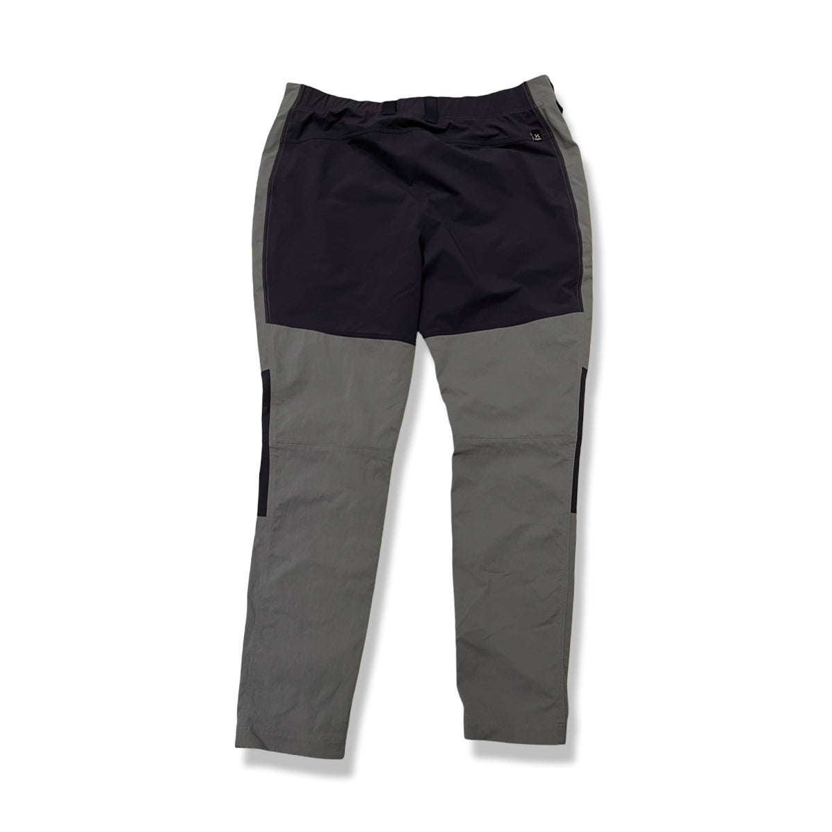 Back view of a pair of blue Haglöfs women's hiking pants in size 46, photographed against a white background.