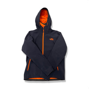 Dark blue The North Face softshell jacket with orange details and a hood, front view against a white background.