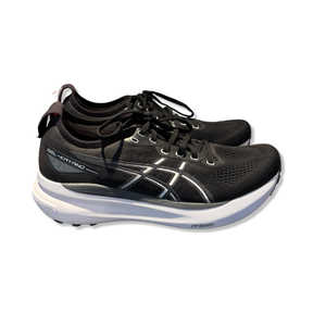 Black Asics Gel-Kayano 31 running shoes with white soles and logo, side view against a white background.