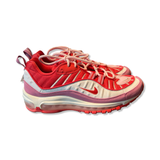 Women's Nike Air Max 98 sneakers in red, pink, and white, side view against a white background.