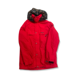 Red Peak Performance men's shell jacket with a patterned hood, front view against a white background.