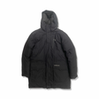 Black hooded down jacket from Peak Performance for men with pockets, front view against a white background.