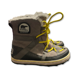 Brown Sorel women's boots with yellow laces and a white faux fur trim, side view.