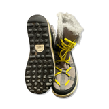Sole and inside of grey Sorel women's boots with yellow laces and faux fur trim, shown against a white background.
