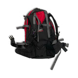 Back view of a black and red Haglöfs backpack with shoulder straps and hip belt against a white background.
