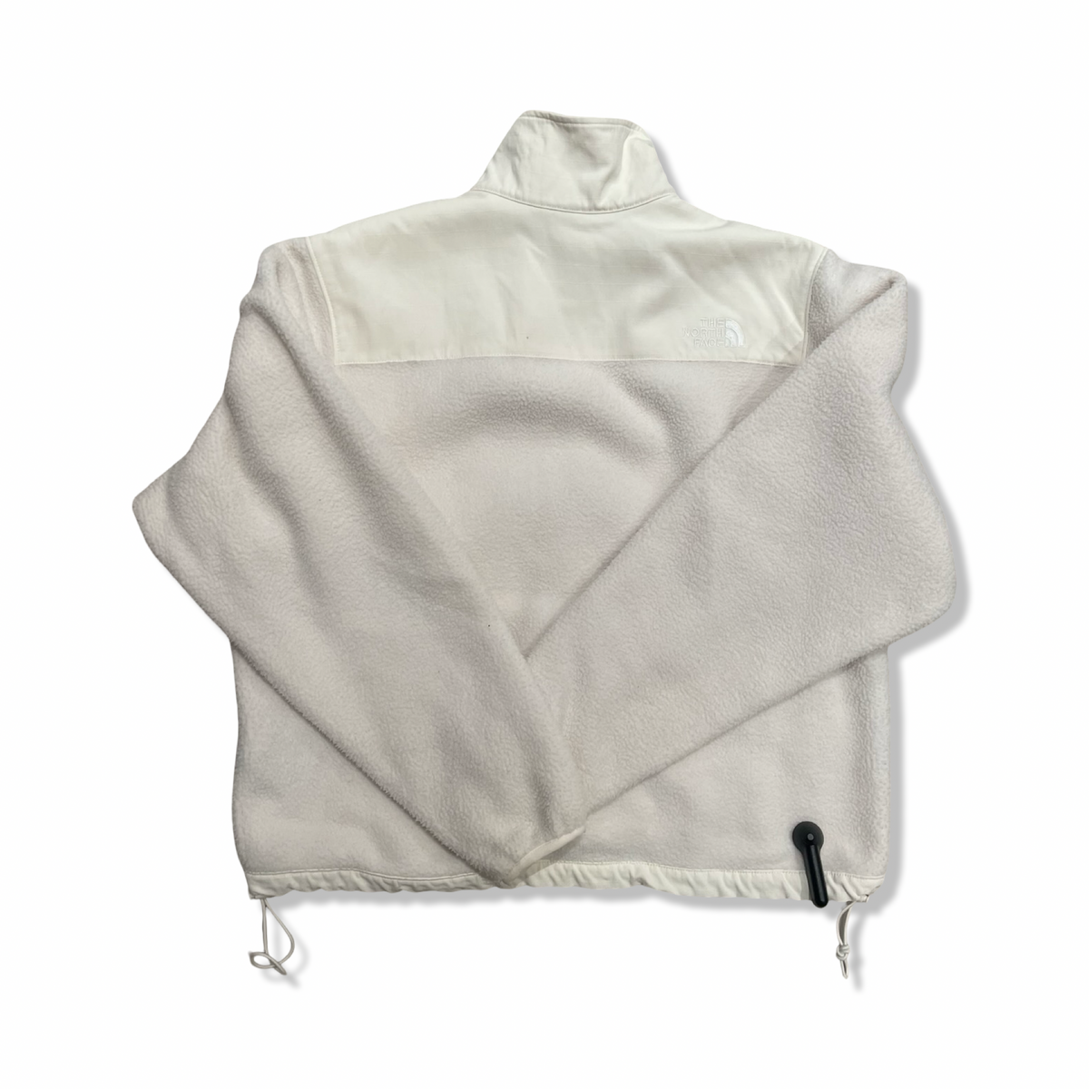 White The North Face women's fleece jacket, back view against a white background.
