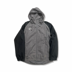 Grey and black Nike women's hooded windstopper jacket, front view against a white background.