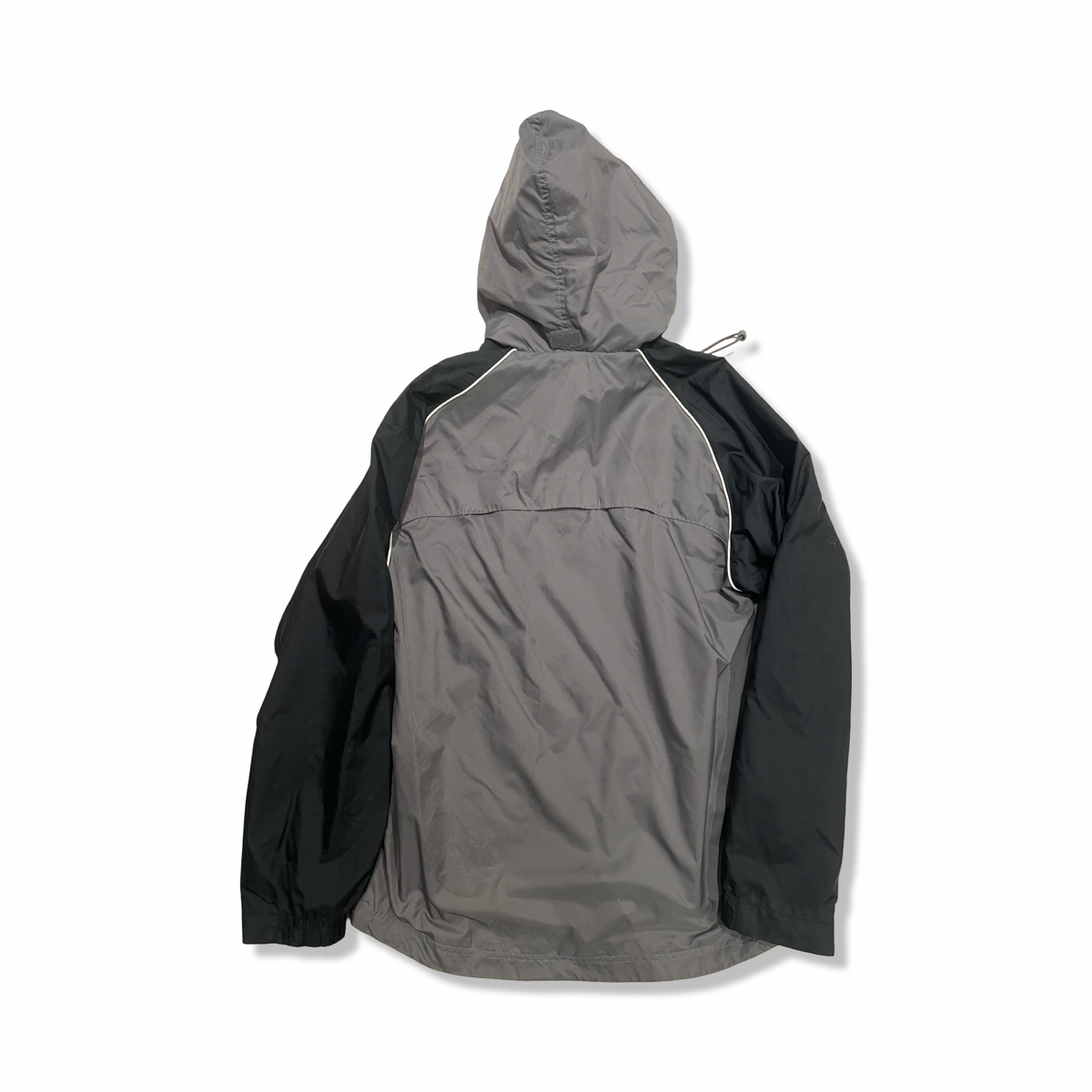 Grey and black hooded Nike women's windstopper jacket, back view against a white background.