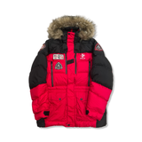 Red and black Ralph Lauren RLX women's parka with a fur-trimmed hood and multiple patches, front view against a white background.