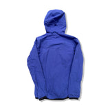 Back view of a purple Haglöfs women's Apex Hood softshell jacket with a hood against a white background.