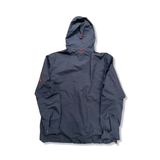 Back view of a grey Stellar Equipment men's shell jacket against a white background.