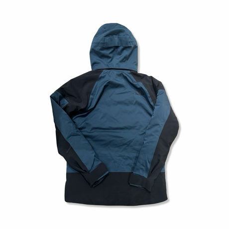 Back view of a blue and black The North Face men's hooded ski jacket against a white background.