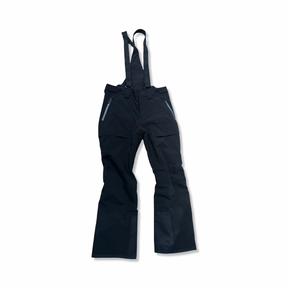 Dark blue The North Face men's ski pants with suspenders, front view against a white background.