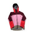 Pink, red and beige women's shell jacket from Peak Performance, front view against a white background.