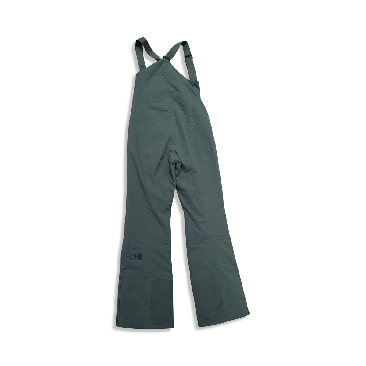 Back view of a green The North Face women's ski pants with suspenders against a white background.